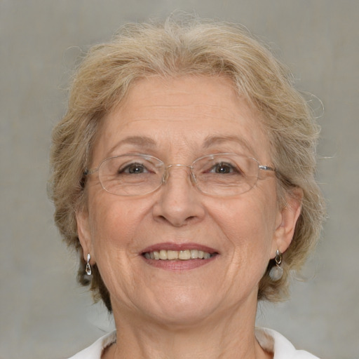 Joyful white middle-aged female with medium  brown hair and brown eyes