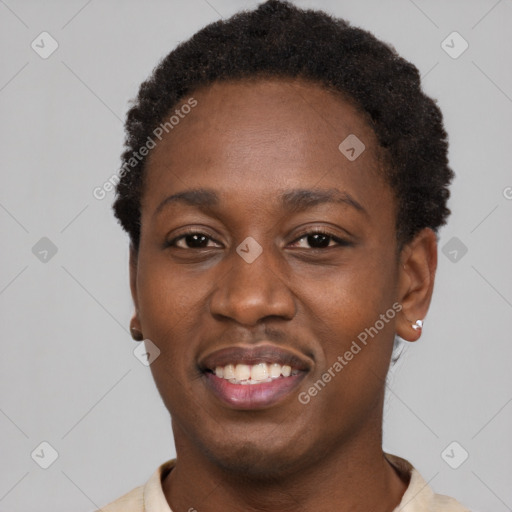 Joyful black young-adult male with short  black hair and brown eyes