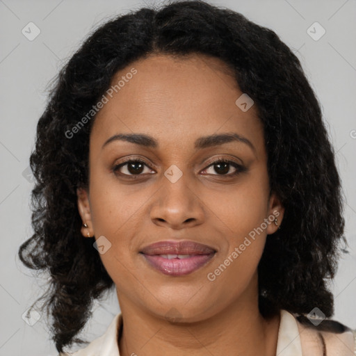 Joyful black young-adult female with long  brown hair and brown eyes