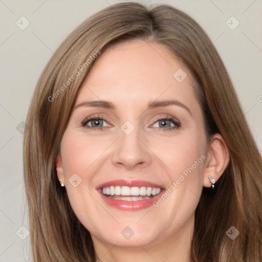 Joyful white young-adult female with long  brown hair and blue eyes