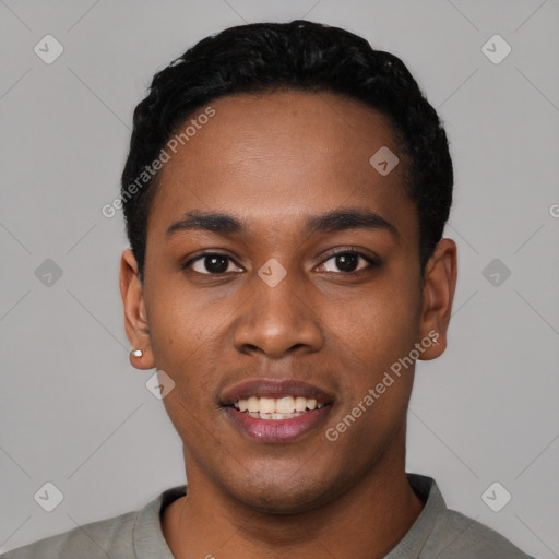 Joyful black young-adult male with short  black hair and brown eyes