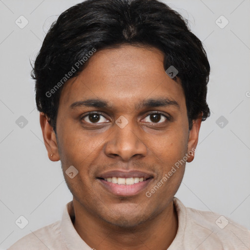 Joyful black young-adult male with short  brown hair and brown eyes