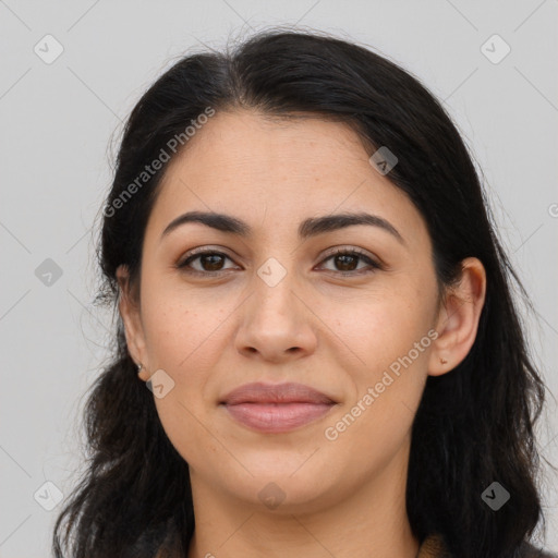 Joyful latino young-adult female with long  brown hair and brown eyes