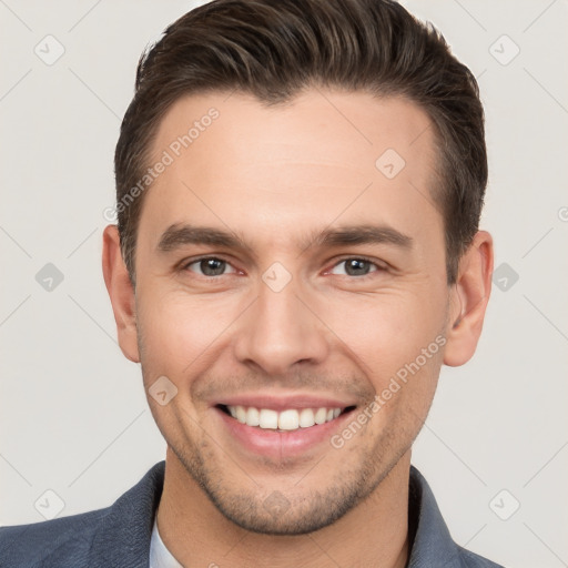 Joyful white young-adult male with short  brown hair and brown eyes