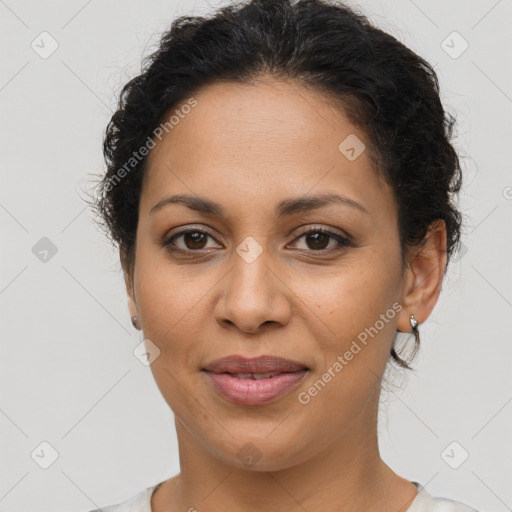 Joyful latino young-adult female with short  brown hair and brown eyes