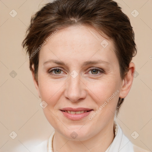 Joyful white adult female with short  brown hair and brown eyes