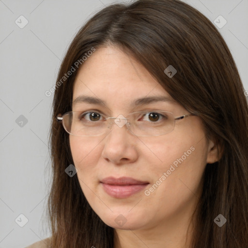 Joyful white adult female with long  brown hair and brown eyes