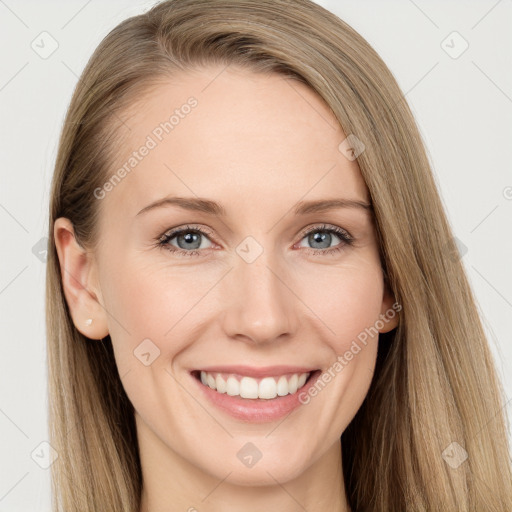 Joyful white young-adult female with long  brown hair and blue eyes