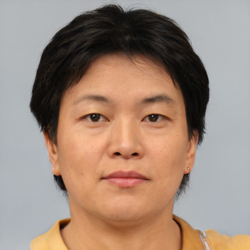 Neutral asian adult female with short  brown hair and brown eyes
