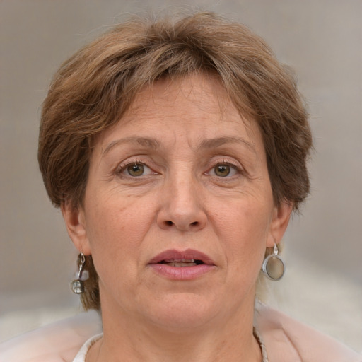 Joyful white middle-aged female with medium  brown hair and brown eyes