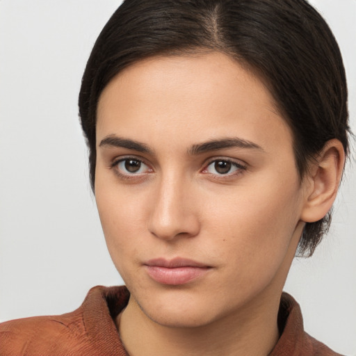 Neutral white young-adult female with medium  brown hair and brown eyes