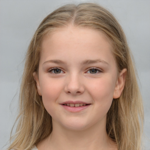 Joyful white child female with long  brown hair and grey eyes