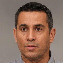 Neutral white adult male with short  black hair and brown eyes