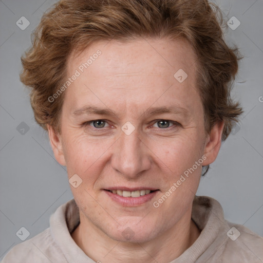 Joyful white adult female with short  brown hair and grey eyes