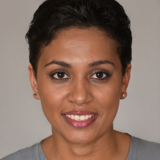 Joyful white young-adult female with short  brown hair and brown eyes