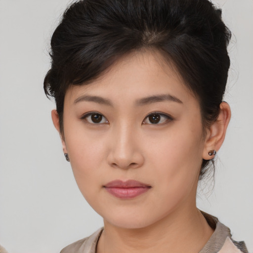 Neutral asian young-adult female with medium  brown hair and brown eyes