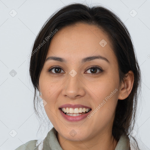 Joyful white young-adult female with long  brown hair and brown eyes