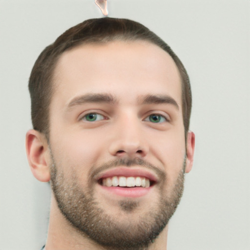 Joyful white young-adult male with short  brown hair and green eyes