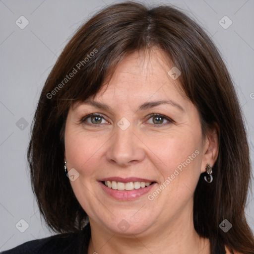 Joyful white adult female with medium  brown hair and brown eyes