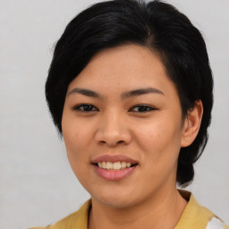 Joyful asian young-adult female with medium  black hair and brown eyes