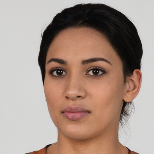 Neutral latino young-adult female with short  black hair and brown eyes