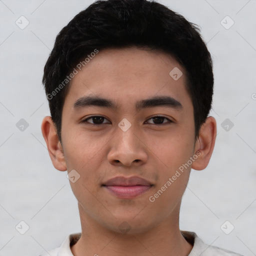 Joyful asian young-adult male with short  black hair and brown eyes