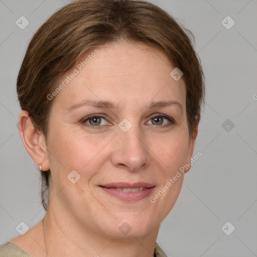 Joyful white adult female with short  brown hair and grey eyes