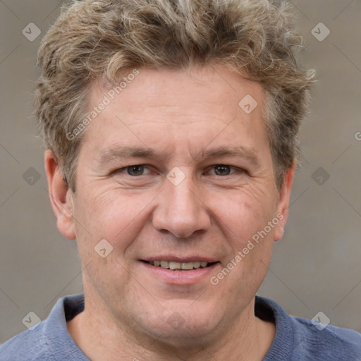 Joyful white adult male with short  brown hair and grey eyes