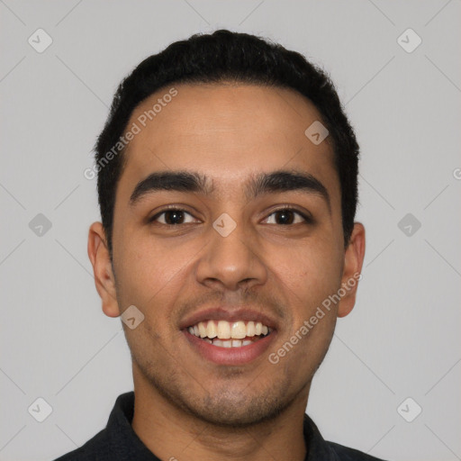 Joyful latino young-adult male with short  black hair and brown eyes