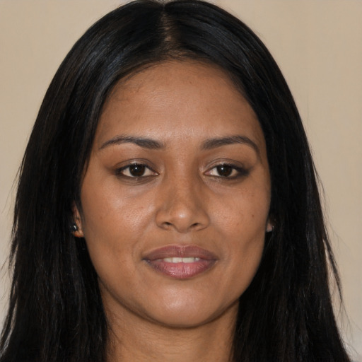 Joyful asian young-adult female with long  black hair and brown eyes