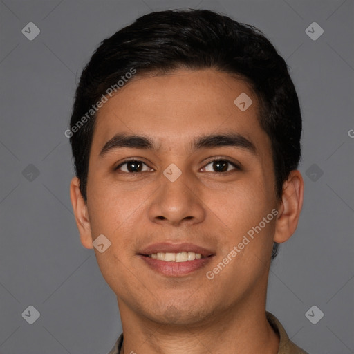 Joyful white young-adult male with short  black hair and brown eyes