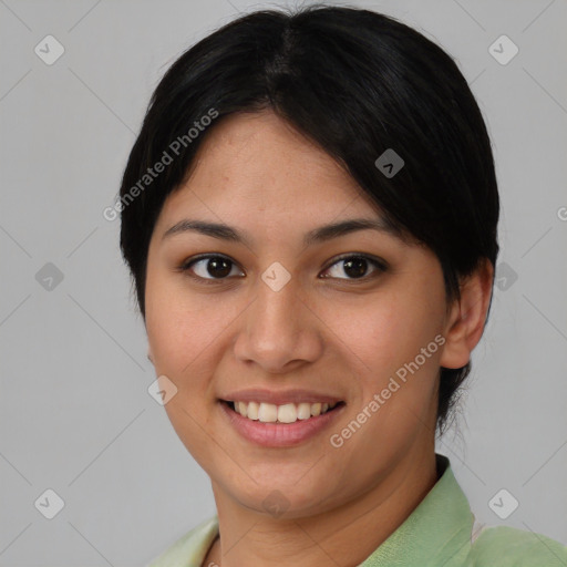 Joyful asian young-adult female with short  black hair and brown eyes