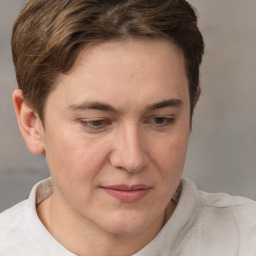 Joyful white adult female with short  brown hair and brown eyes