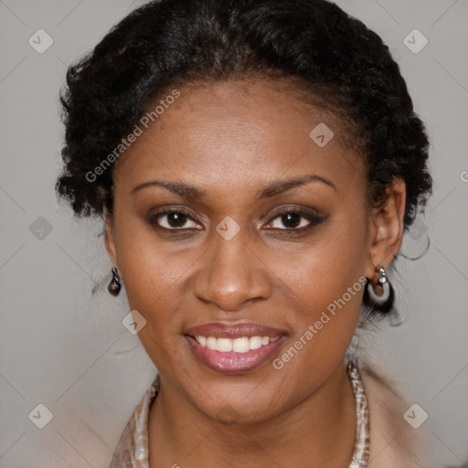 Joyful black adult female with short  brown hair and brown eyes