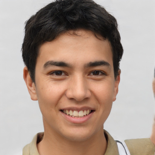Joyful latino young-adult male with short  brown hair and brown eyes