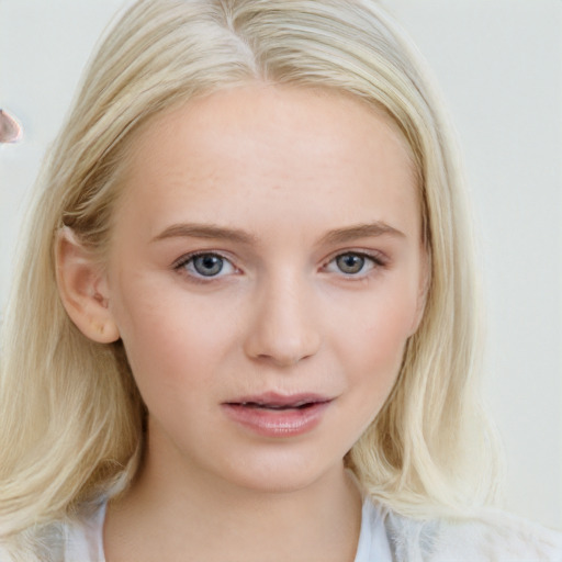 Joyful white young-adult female with medium  blond hair and blue eyes