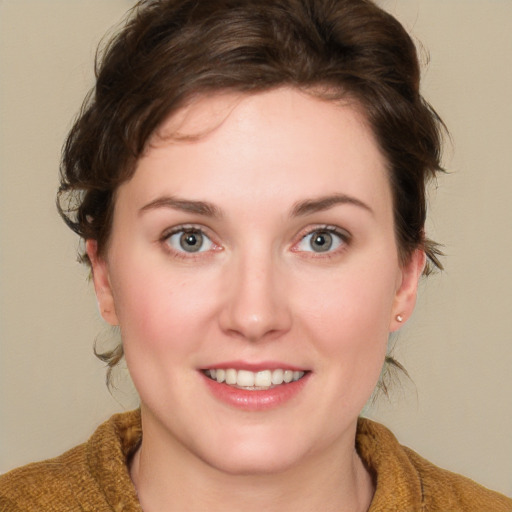 Joyful white young-adult female with medium  brown hair and green eyes