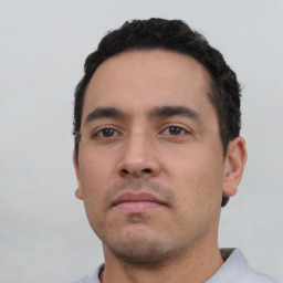 Neutral white young-adult male with short  black hair and brown eyes
