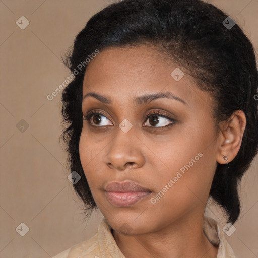 Joyful black young-adult female with medium  brown hair and brown eyes