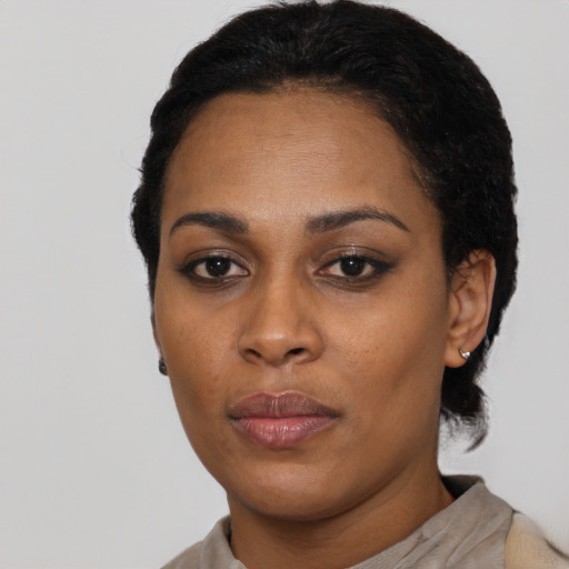 Neutral black young-adult female with short  black hair and brown eyes