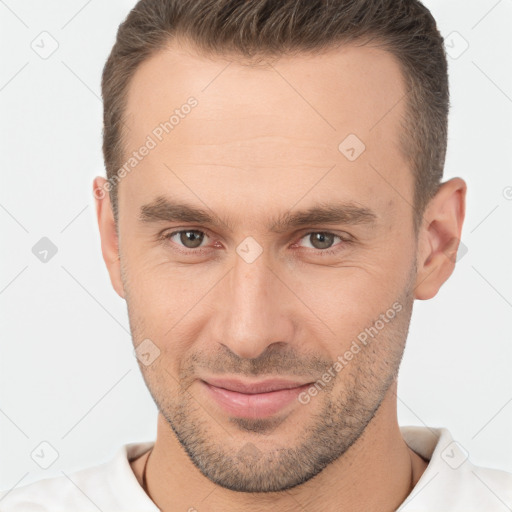 Joyful white adult male with short  brown hair and brown eyes