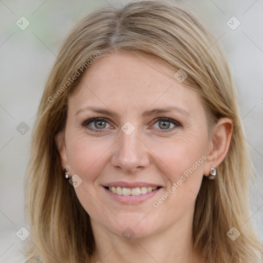 Joyful white adult female with long  brown hair and grey eyes