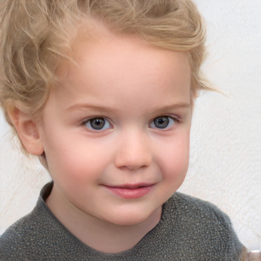 Joyful white child female with short  blond hair and blue eyes