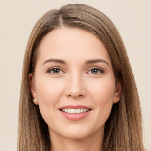 Joyful white young-adult female with long  brown hair and brown eyes