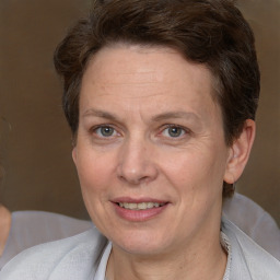 Joyful white adult female with short  brown hair and brown eyes