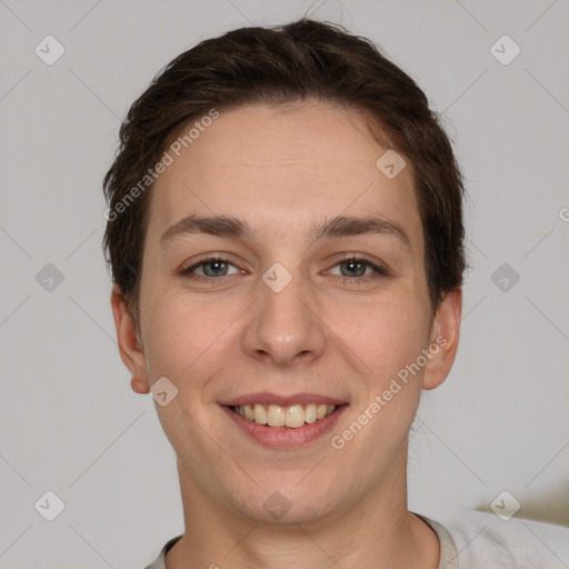 Joyful white young-adult female with short  brown hair and grey eyes