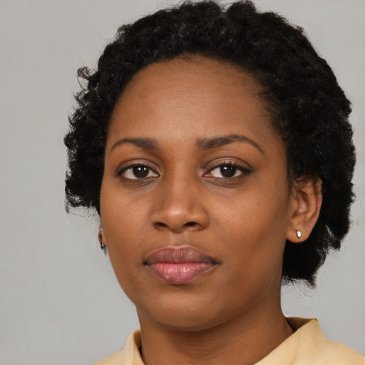 Neutral black young-adult female with short  black hair and brown eyes