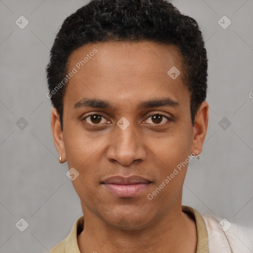 Joyful black young-adult male with short  black hair and brown eyes