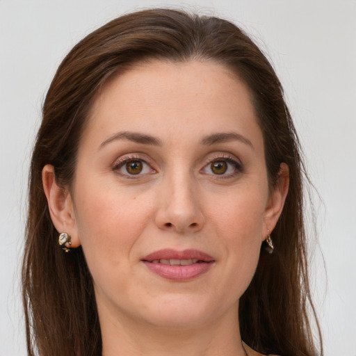 Joyful white young-adult female with long  brown hair and grey eyes