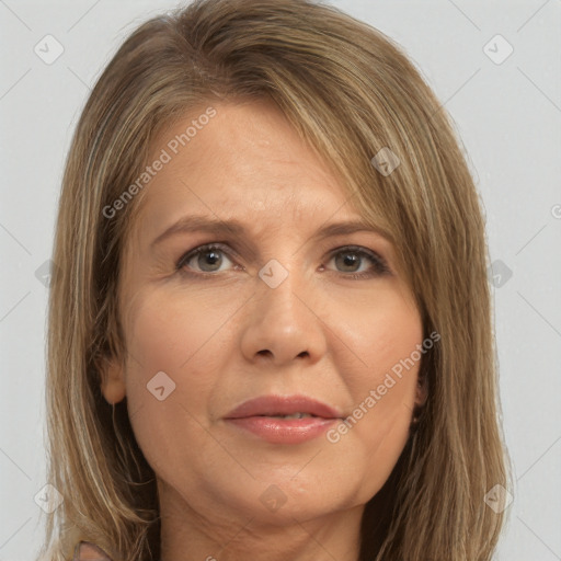 Joyful white adult female with long  brown hair and brown eyes